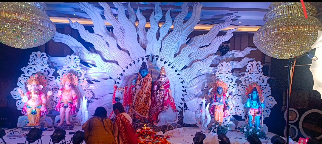Devotional stage with ornate sunburst backdrop