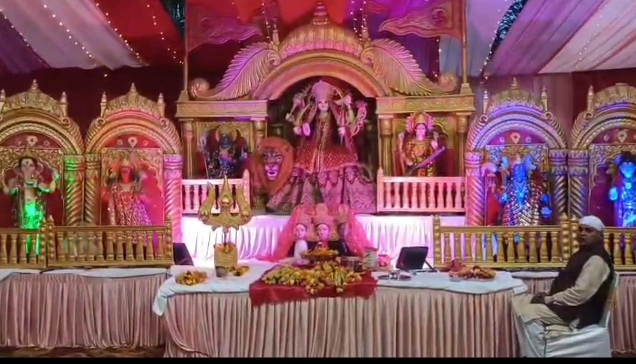 Devotional event stage with vibrant idol decorations